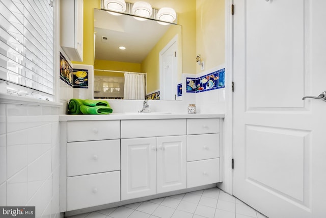 bathroom featuring tile floors and vanity