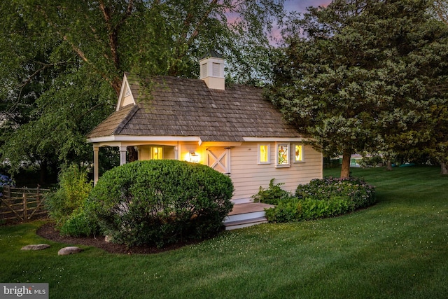 view of front of home with a yard