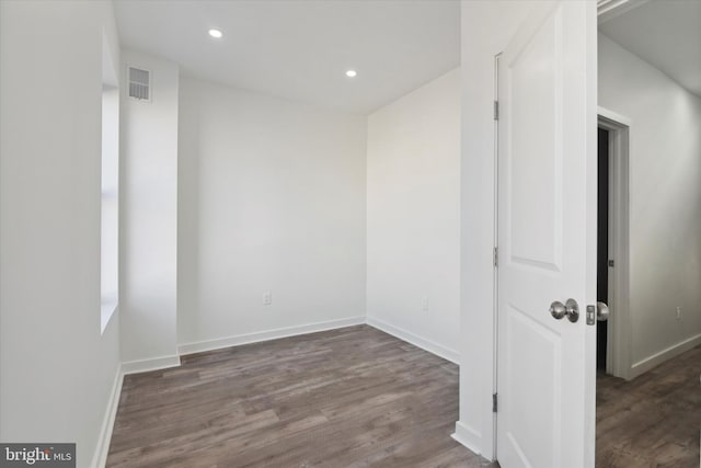 empty room featuring dark hardwood / wood-style floors