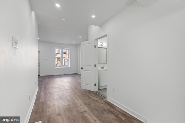 hallway with dark hardwood / wood-style floors