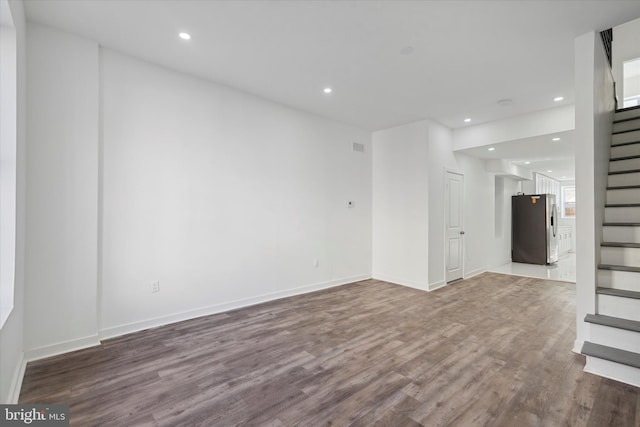 unfurnished room featuring hardwood / wood-style flooring