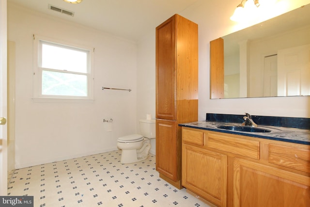 bathroom with vanity and toilet