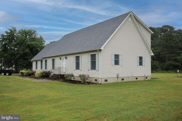 view of side of property with a yard