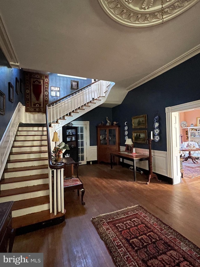 living room with hardwood / wood-style flooring and ornamental molding