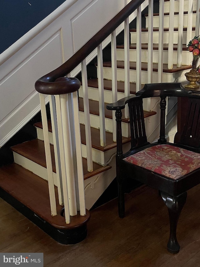 stairs featuring hardwood / wood-style flooring