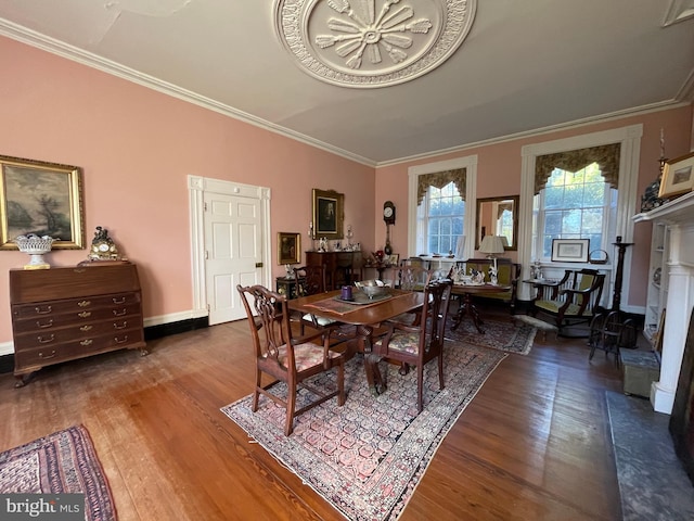 dining room featuring ornamental molding and hardwood / wood-style floors