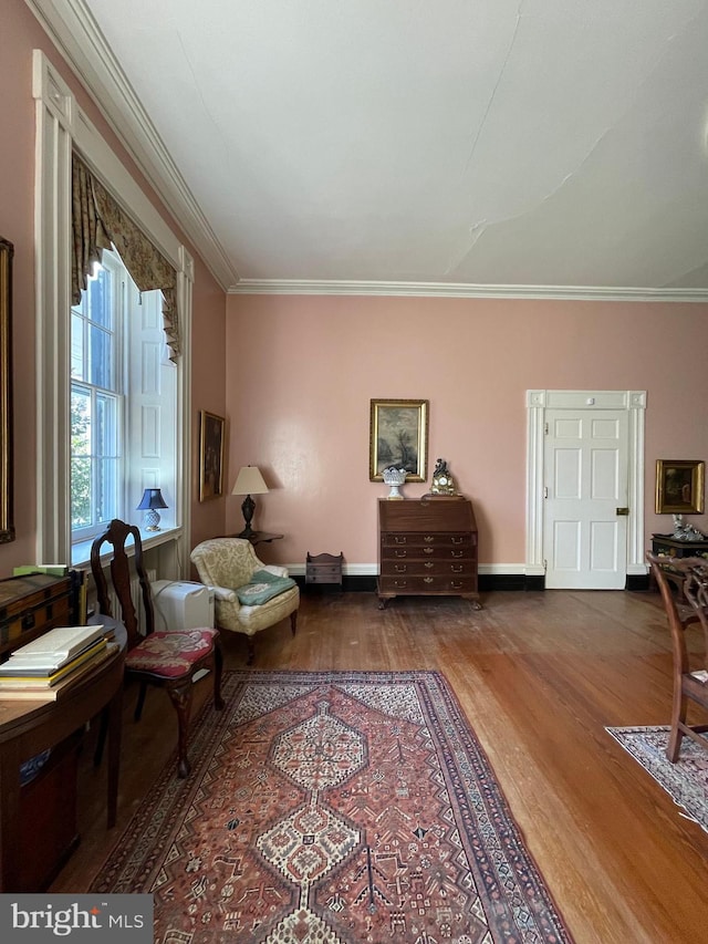 living room with ornamental molding and wood-type flooring