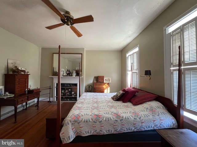 bedroom with hardwood / wood-style floors and ceiling fan