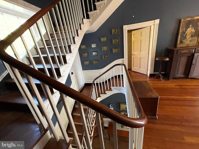 stairs featuring hardwood / wood-style flooring