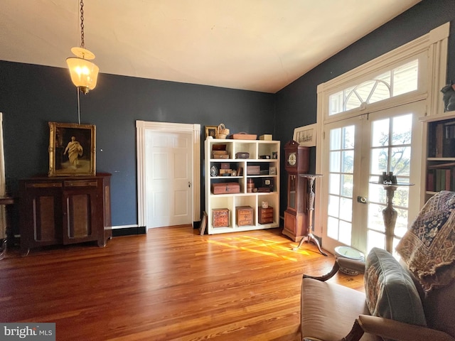 living area featuring light hardwood / wood-style flooring and french doors