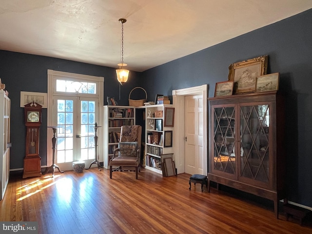 sitting room featuring hardwood / wood-style floors and french doors