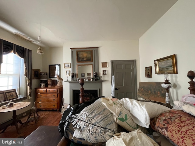 bedroom with dark wood-type flooring