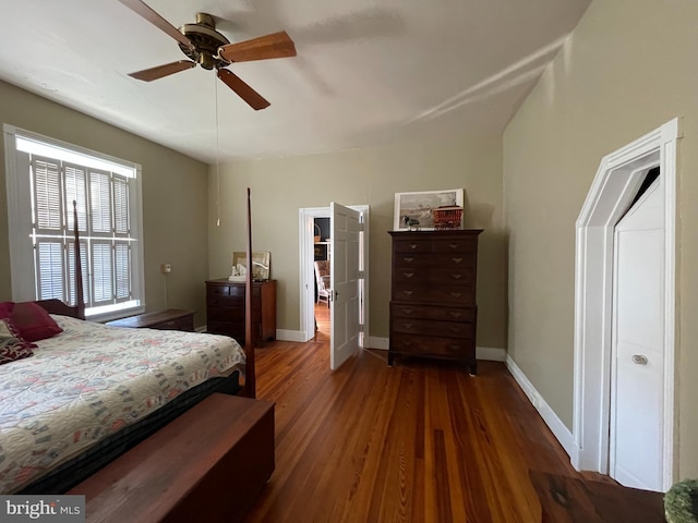 bedroom with ceiling fan and dark hardwood / wood-style flooring