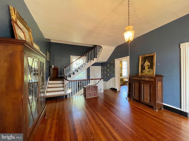 entryway with dark hardwood / wood-style flooring