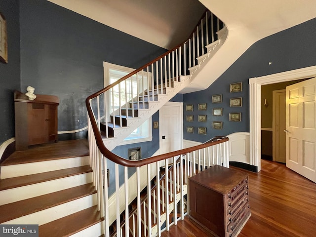 staircase with wood-type flooring