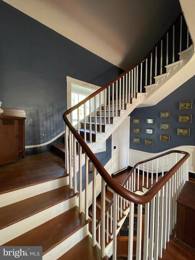 staircase featuring hardwood / wood-style floors