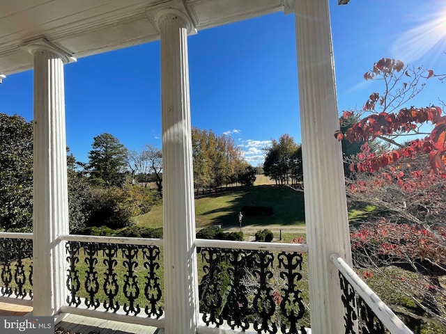 exterior space featuring plenty of natural light and decorative columns