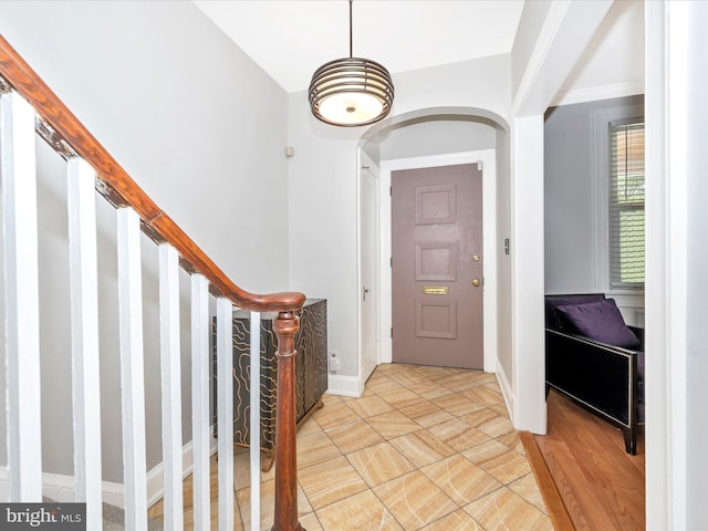 entrance foyer featuring light tile floors