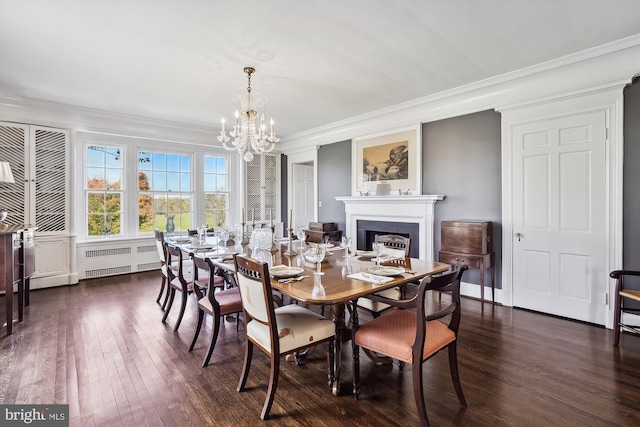 dining room with a chandelier, radiator heating unit, dark hardwood / wood-style floors, and ornamental molding