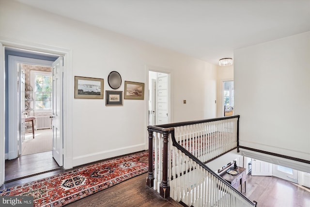 hall with wood-type flooring