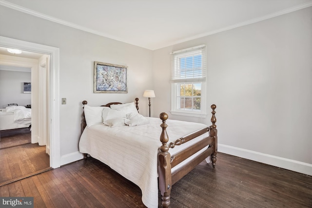 bedroom with dark hardwood / wood-style flooring and crown molding