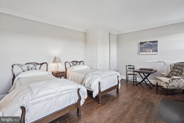 bedroom with dark hardwood / wood-style floors and ornamental molding