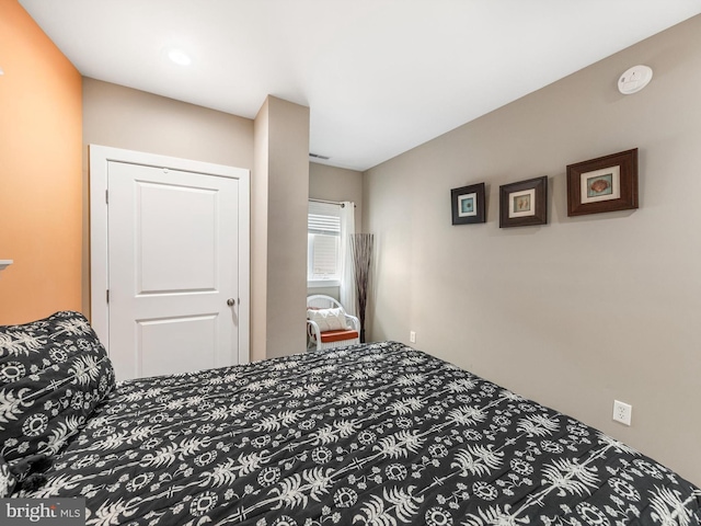 carpeted bedroom with a closet