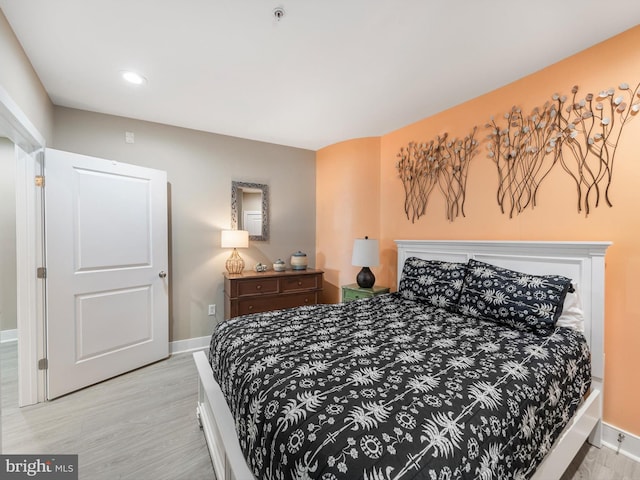 bedroom with light hardwood / wood-style flooring