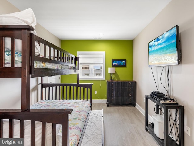 bedroom with light wood-type flooring