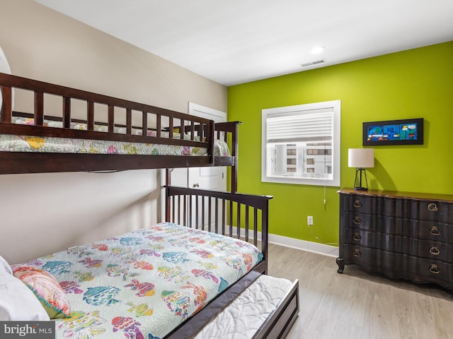 bedroom with light hardwood / wood-style flooring