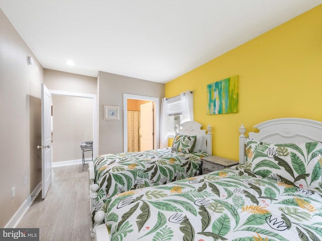 bedroom featuring light wood-type flooring