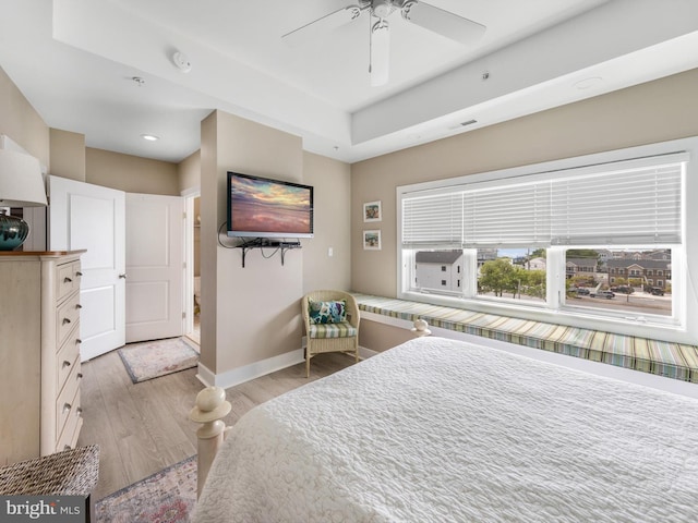 bedroom featuring ceiling fan and light hardwood / wood-style flooring