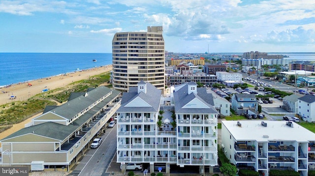 bird's eye view featuring a beach view and a water view