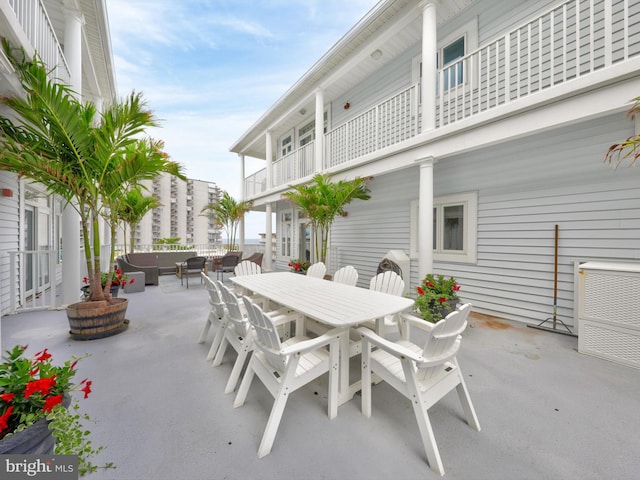 view of patio featuring a balcony