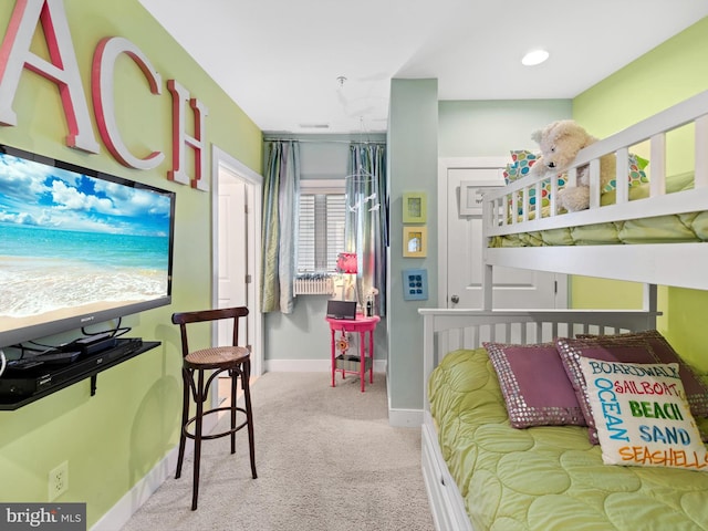 bedroom featuring light carpet