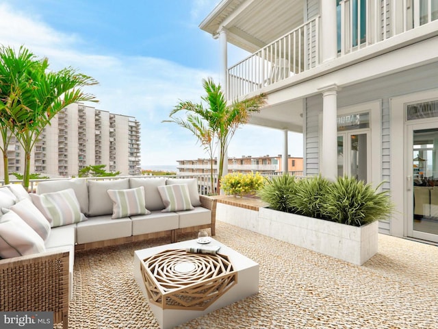 view of patio featuring a balcony and an outdoor hangout area