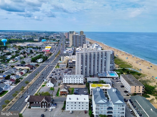 birds eye view of property featuring a water view and a view of the beach