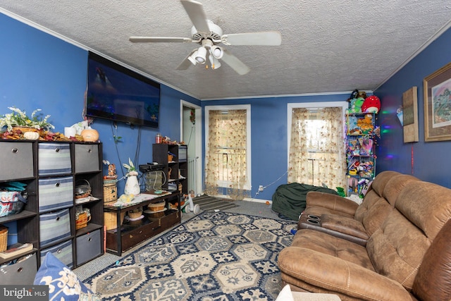 living room with a textured ceiling, ceiling fan, and carpet floors