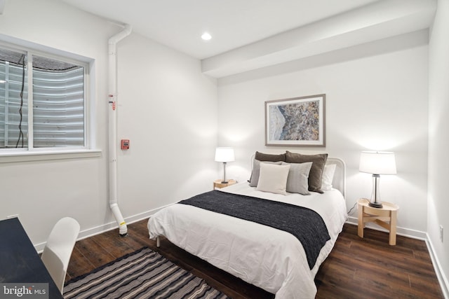 bedroom featuring dark hardwood / wood-style flooring