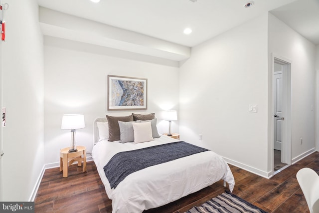 bedroom featuring dark hardwood / wood-style flooring