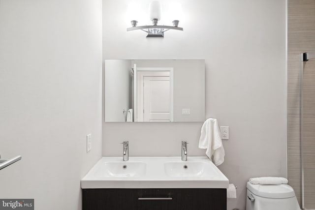 bathroom with toilet and vanity