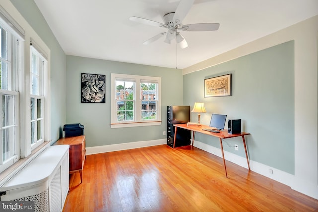 office area featuring ceiling fan and light hardwood / wood-style floors