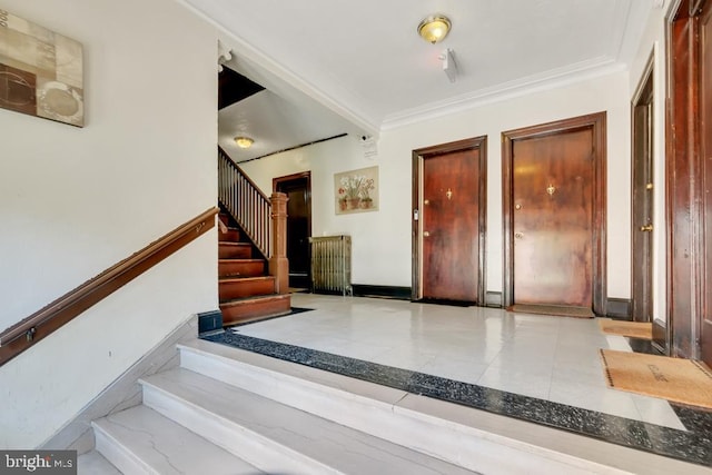 stairs featuring ornamental molding and light tile floors