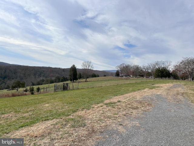 view of yard with a rural view