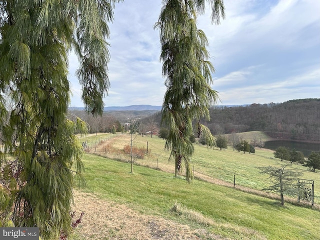 mountain view featuring a rural view