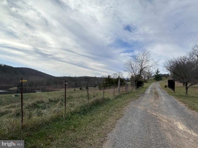 view of road with a mountain view and a rural view