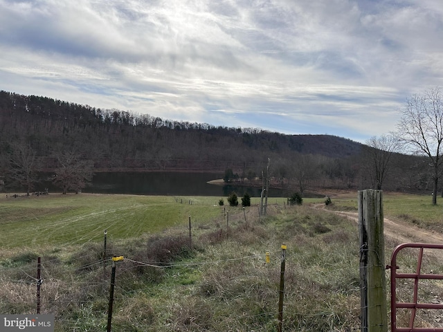 view of mountain feature with a water view and a rural view