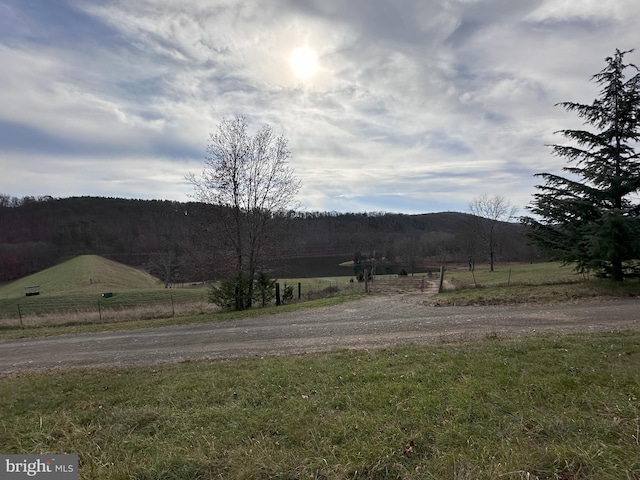 property view of mountains featuring a rural view