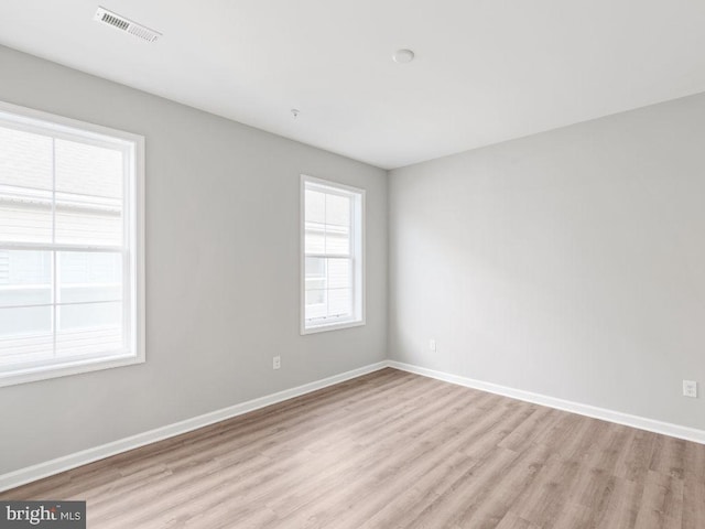 spare room featuring light hardwood / wood-style flooring