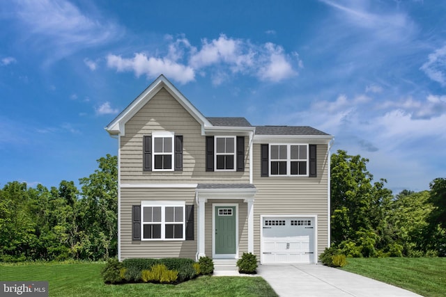 view of front property with a garage and a front yard